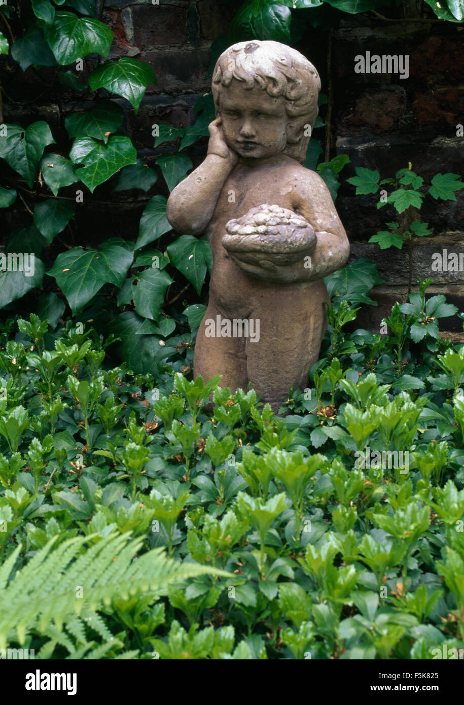 Stone sculpture of a cherub hires stock photography and images Alamy