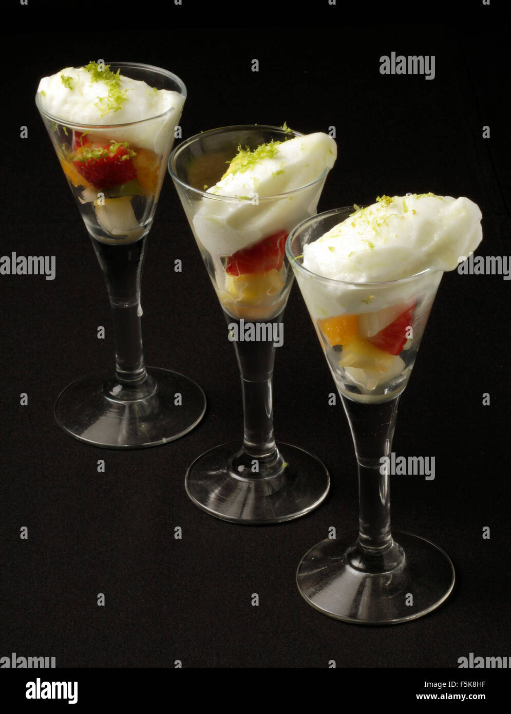 Sweet dessert presentation. Fruit salad with ice cream Stock Photo Alamy