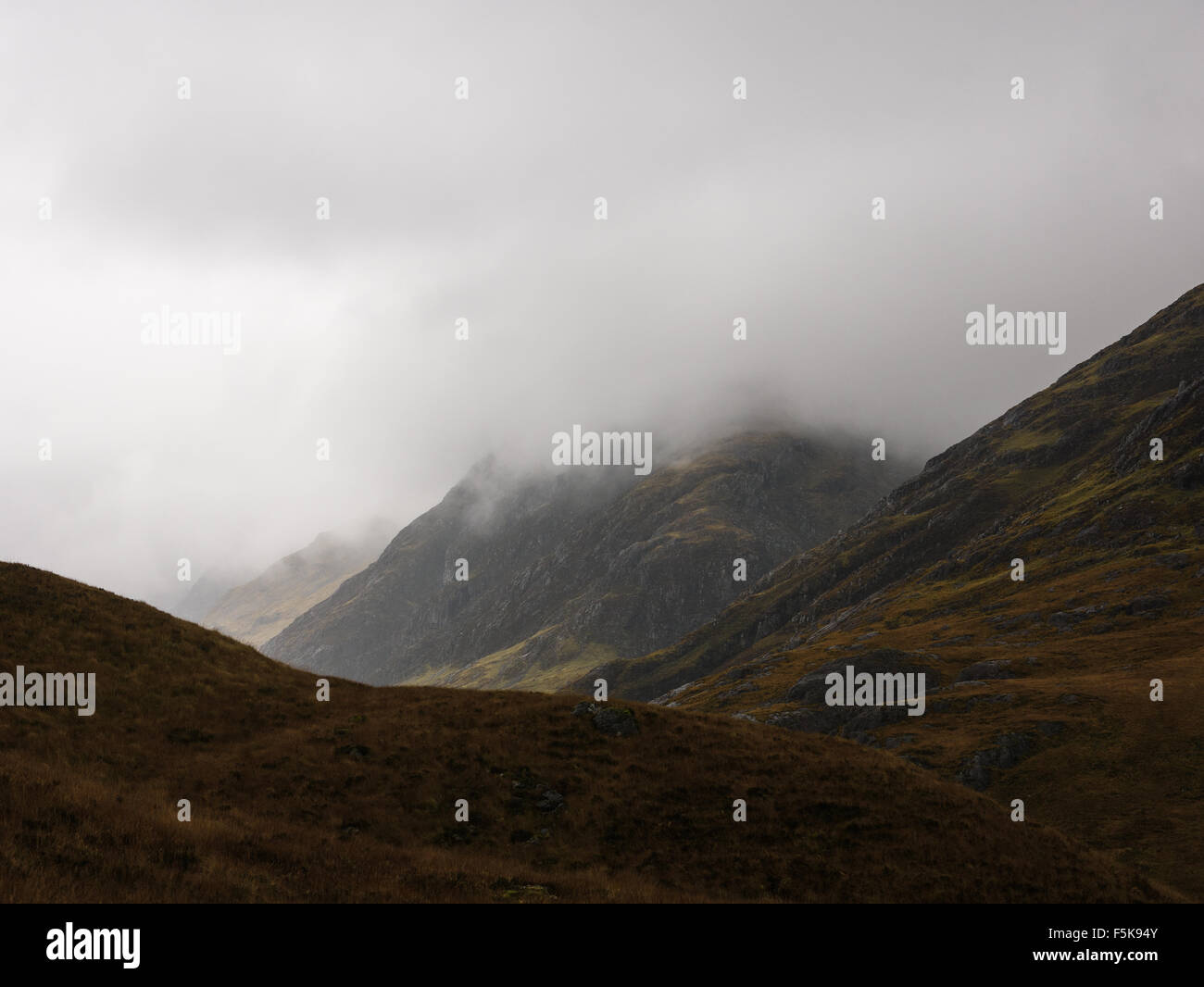 Mist and rain covering the mountains and pass of Glencoe, scottish
