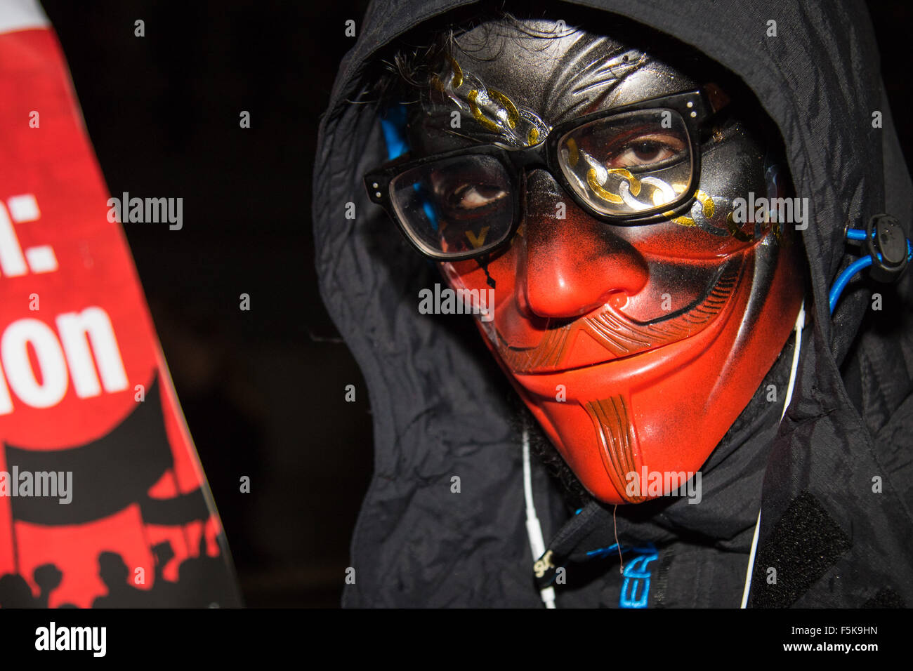 London, November 5th 2015.  Anarchists and anti-establishment activists hold their annual Million Mask March on Guy Fawkes night, enduring rain and a heavy police presence. The marches origins lie with the online activism group Anonymous. Credit:  Paul Davey/Alamy Live News Stock Photo
