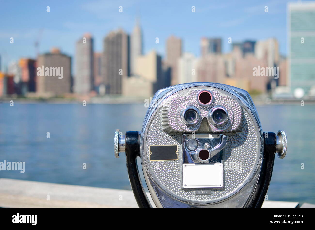 Shiny binoculars with stunning Manhattan view Stock Photo