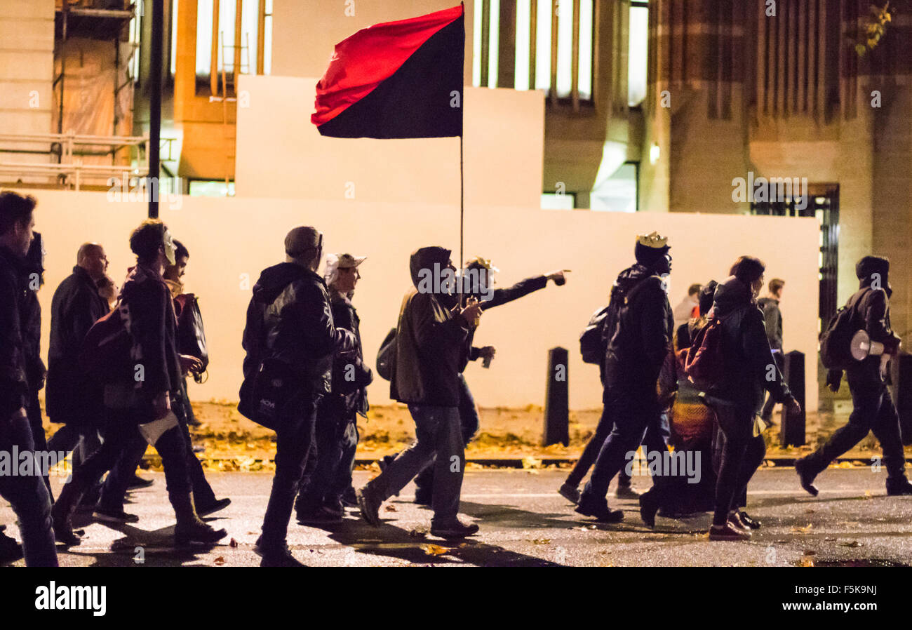 London, November 5th 2015.  Anarchists and anti-establishment activists hold their annual Million Mask March on Guy Fawkes night, enduring rain and a heavy police presence. The marches origins lie with the online activism group Anonymous. Credit:  Paul Davey/Alamy Live News Stock Photo