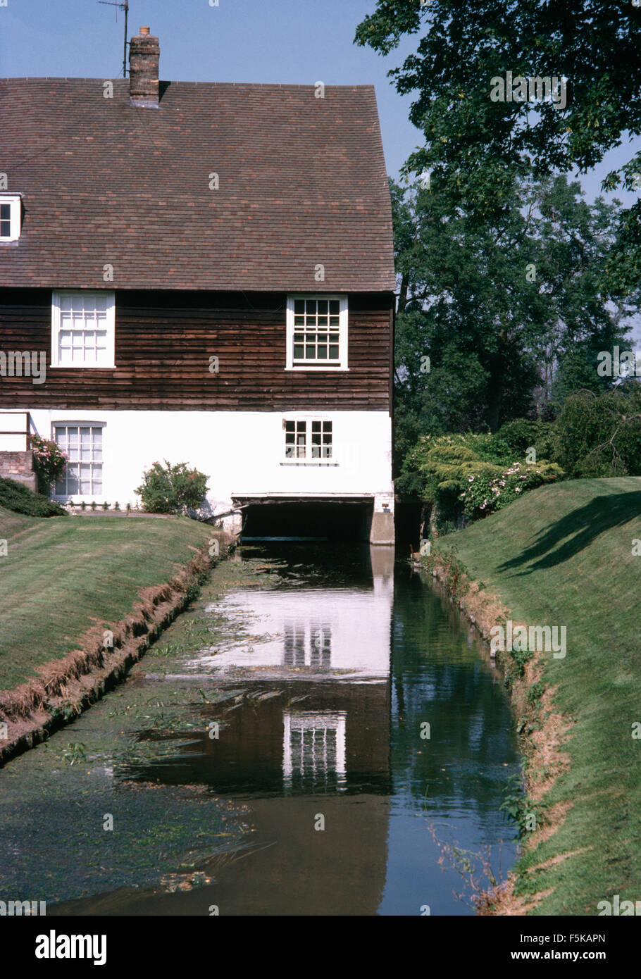 Exterior of a traditional mill house with mill stream Stock Photo