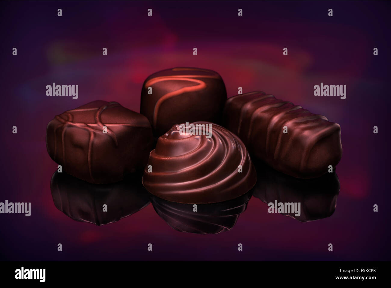 Fine chocolates are seen against a light painted background in studio, 2015. (Adrien Veczan) Stock Photo