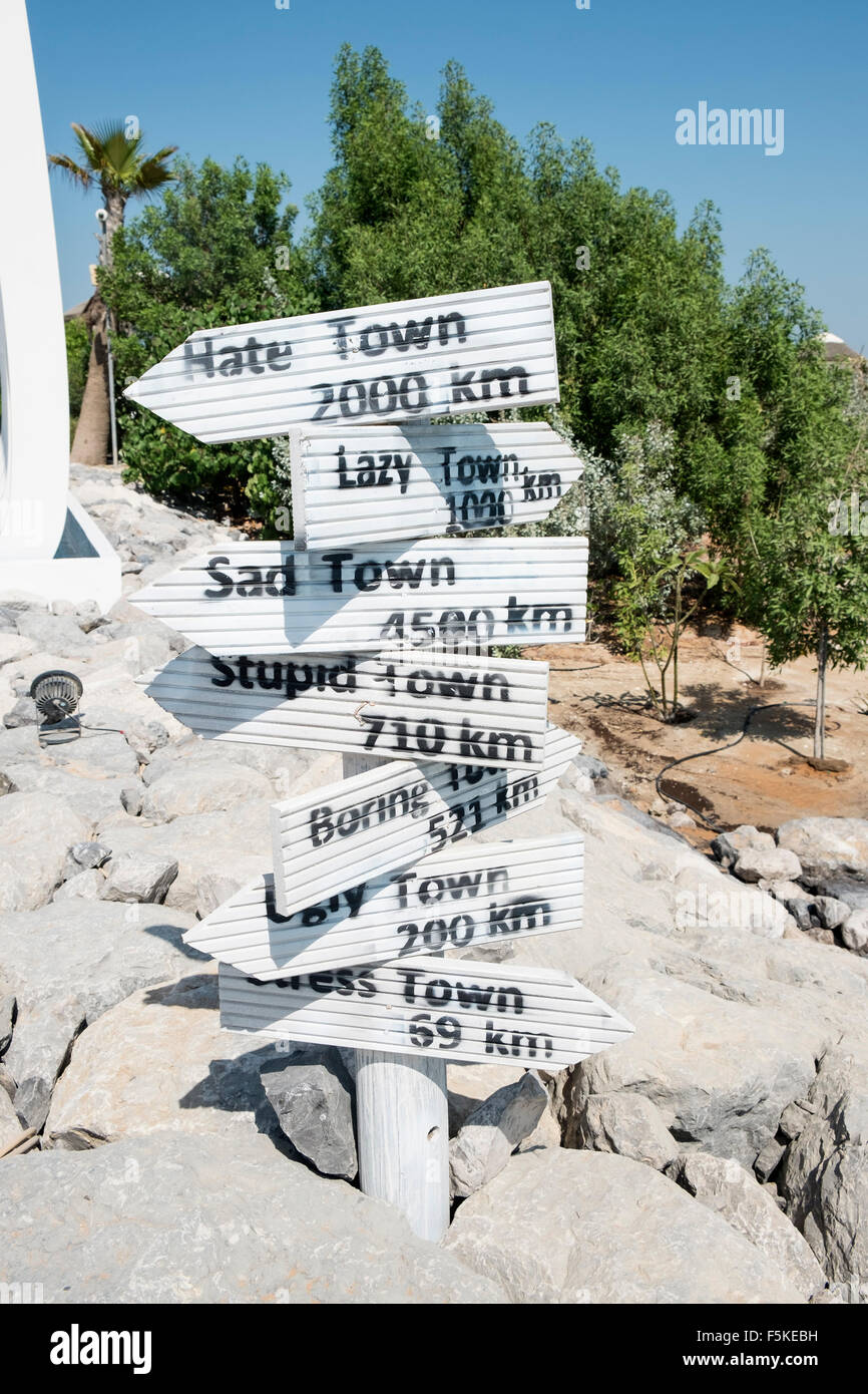 Signposts at The Island Lebanon beach resort on a man made island, part of The World off Dubai coast in  United Arab Emirates Stock Photo