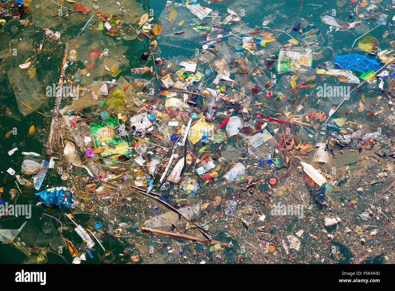 ATHENS, GREECE - OCTOBER 25, 2015: Port of Piraeus, a large amount of trash polluting the wate Stock Photo