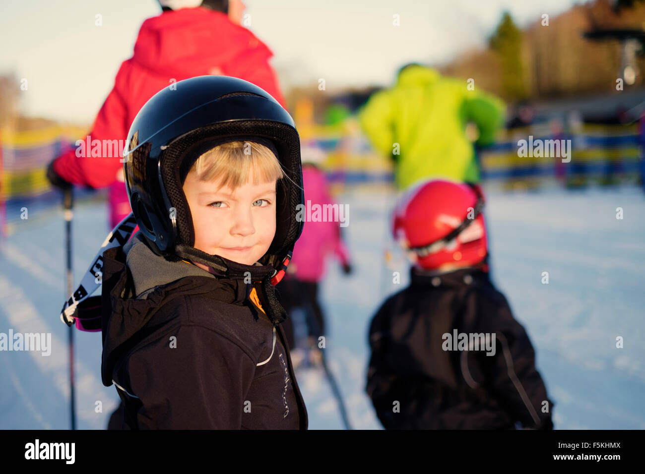 Sweden, Dalarna, Salen, Portrait of girl (4-5) smiling on ski slope Stock Photo