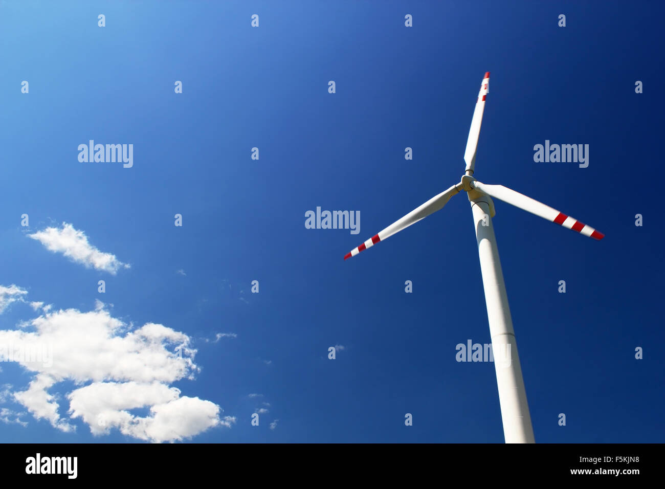 Wind Turbine at blue sky background Stock Photo - Alamy