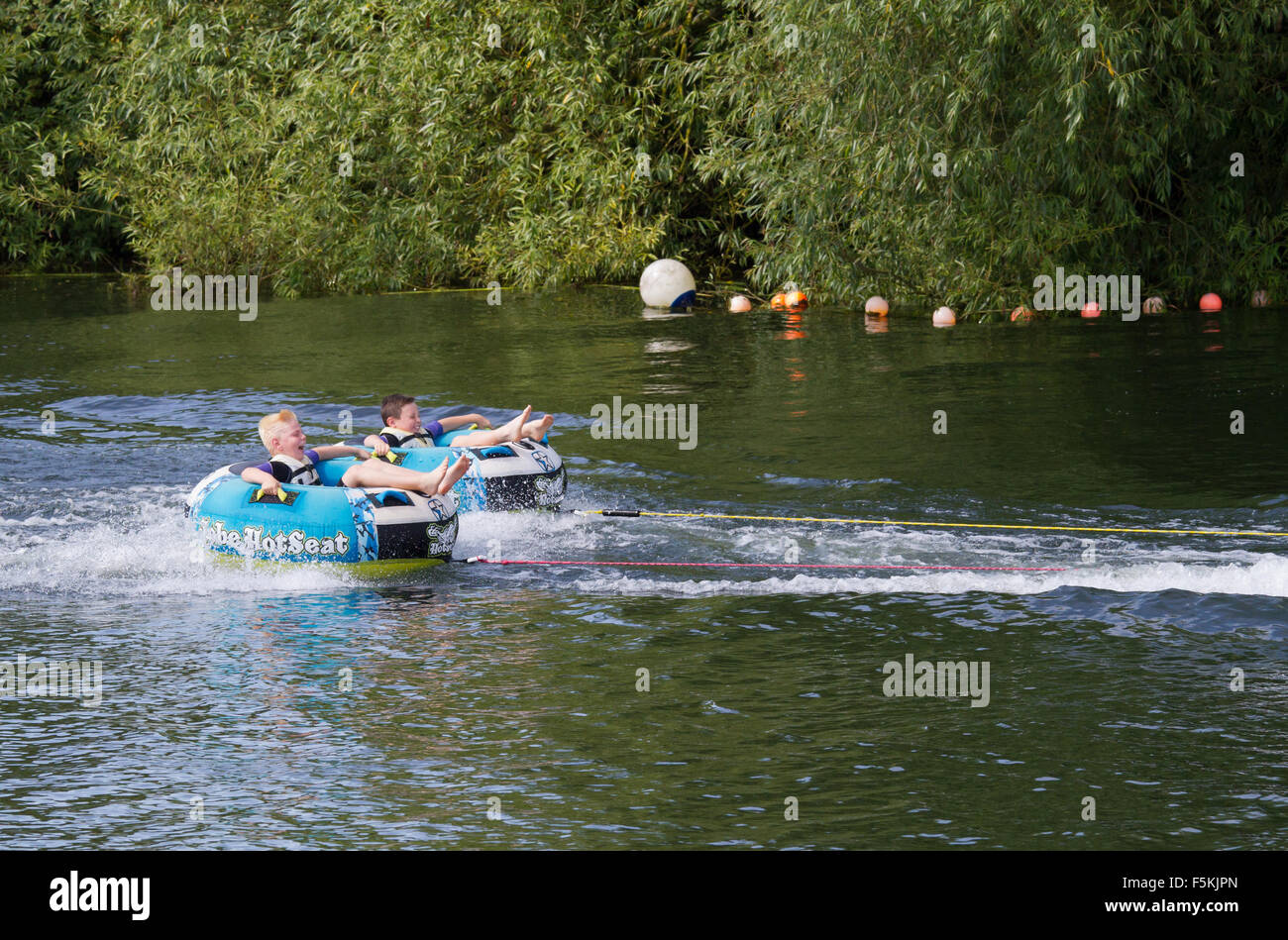 Children messing about on the river lake in ringos Stock Photo Alamy