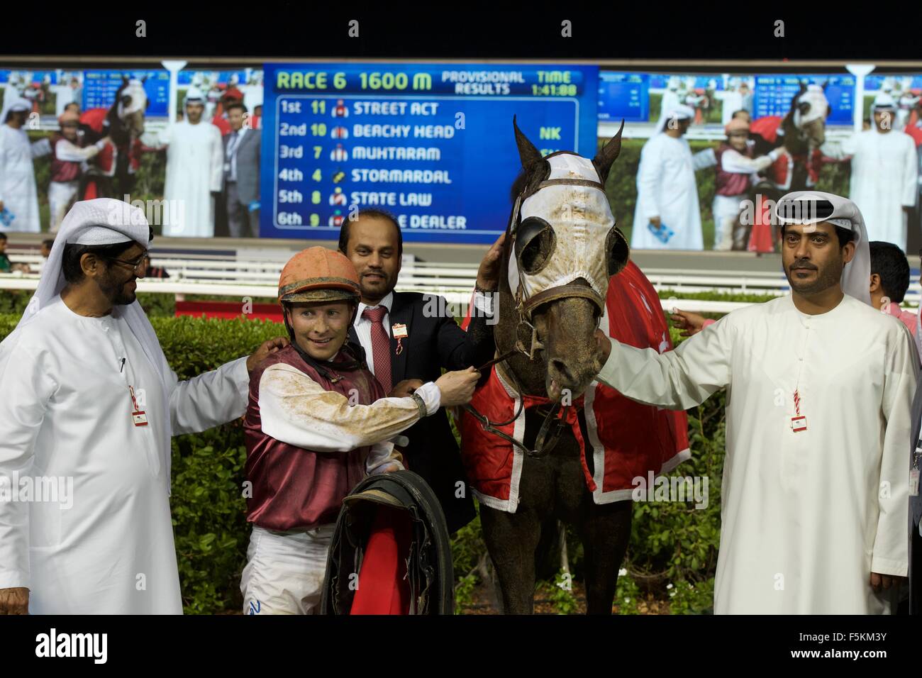 Meydan racecourse, UAE. 5th November, 2015.   His Excellency Sheikh Ahmed Bin Mohamed Al Maktoum and Tadhg O'Shea with Street Act after race 6 the Thoroughbreds Handicap 74-89 at Meydan Credit:  Tom Morgan/Alamy Live News Stock Photo