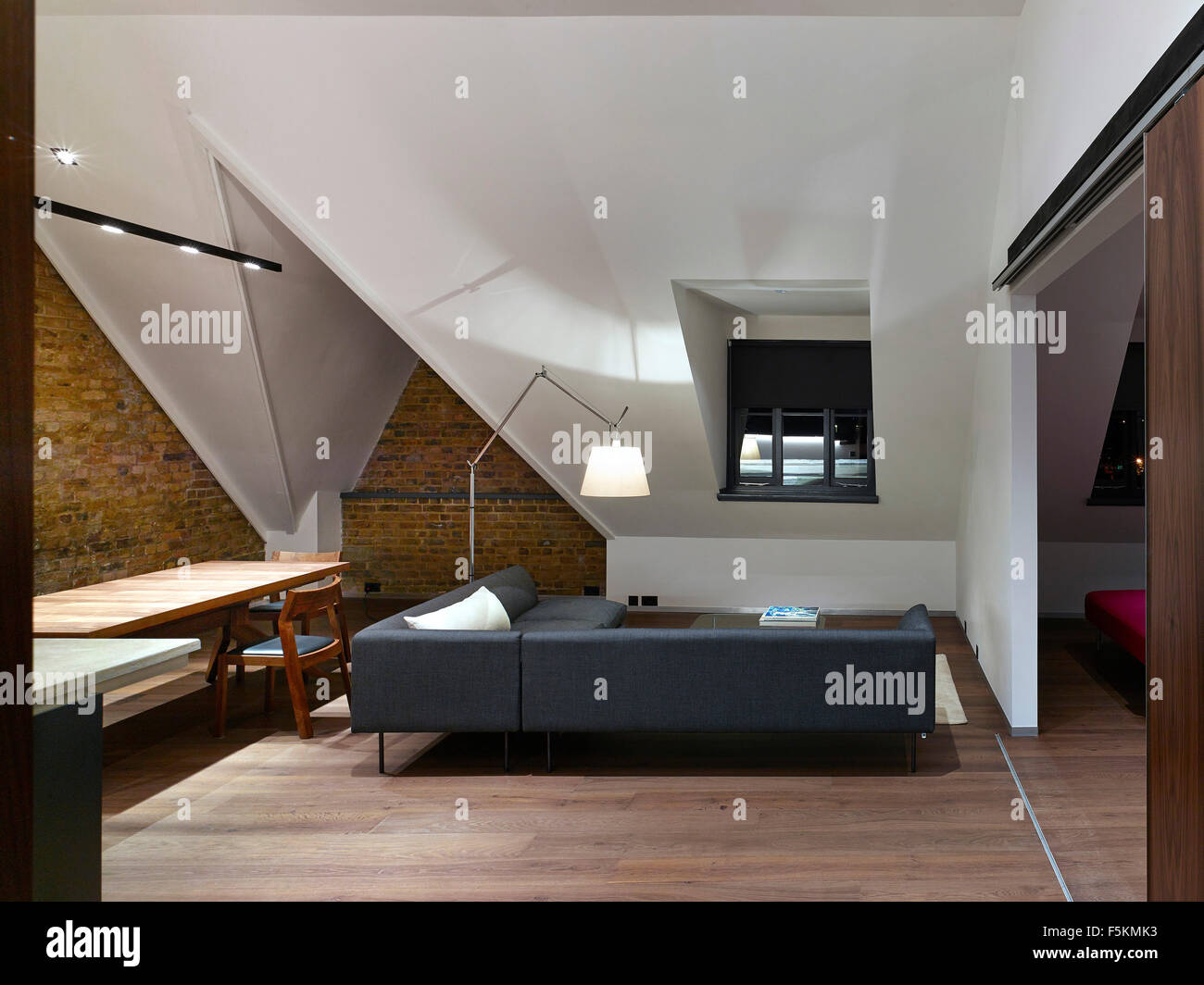 Detail of open plan living area with pitched roof. Mandeville apartment ...