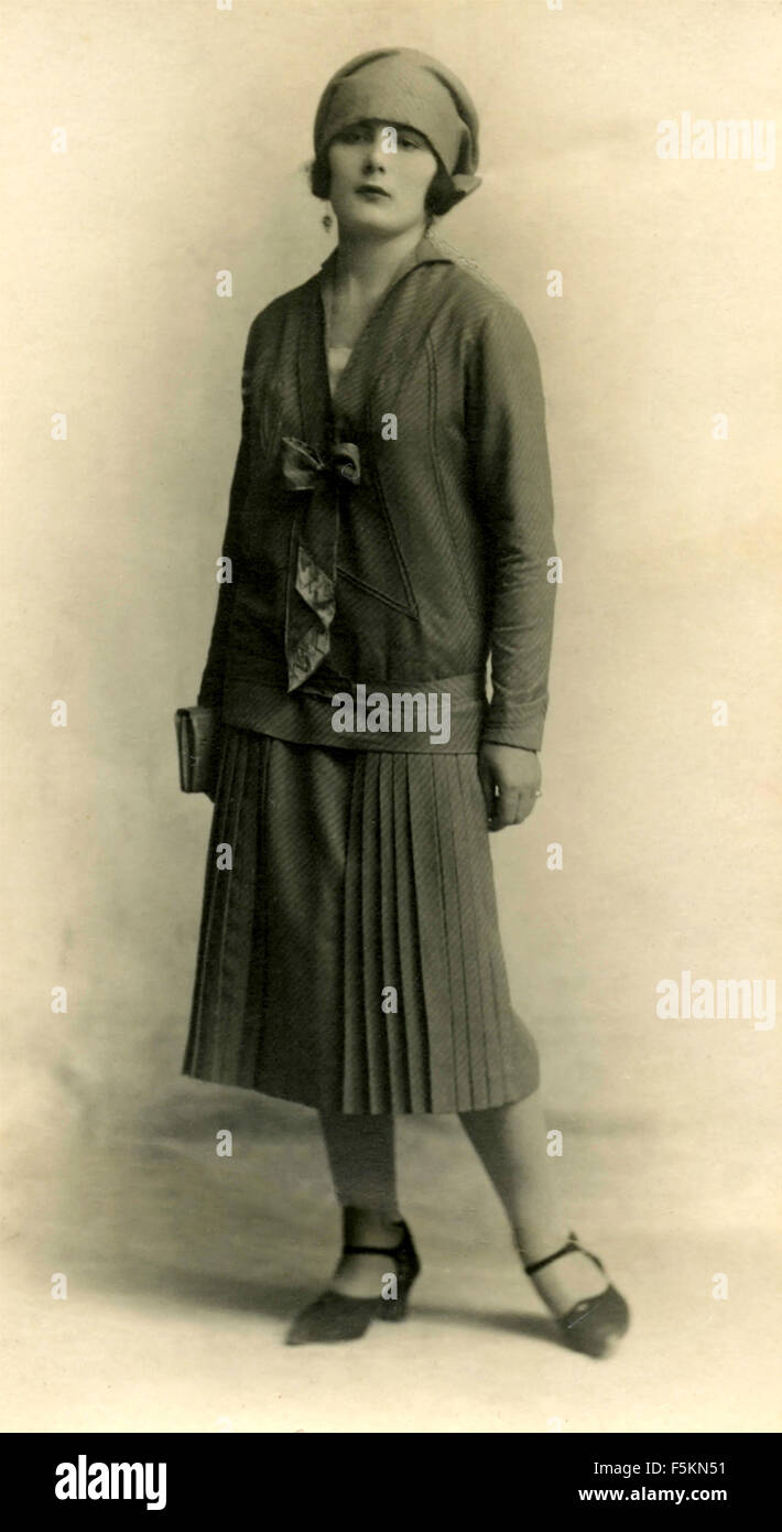 Portrait of woman with hat and pleated skirt, Italy Stock Photo
