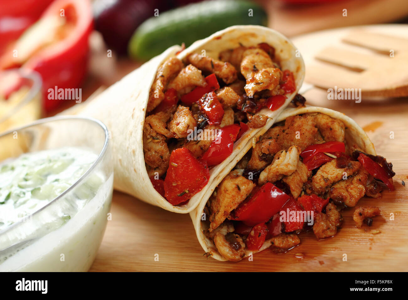 Making Tortilla with chicken and bell pepper. Series. Stock Photo