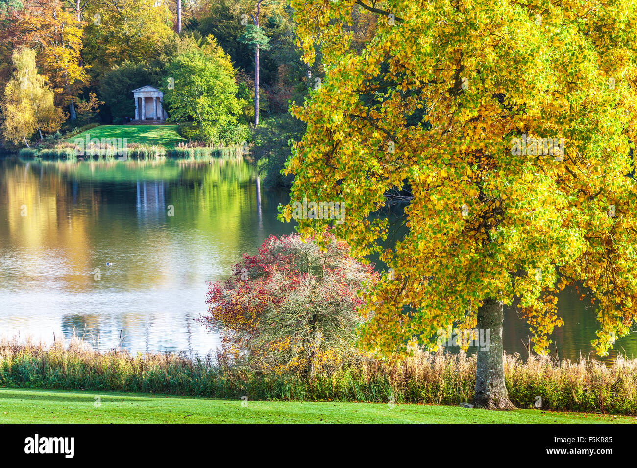 The Doric Temple on the lake on the Bowood Estate in Wiltshire in autumn. Stock Photo