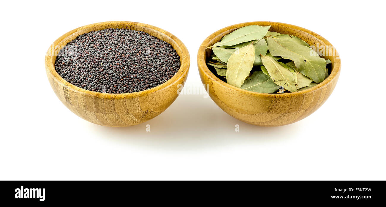 Peppery mustard and dried bay leaves Stock Photo