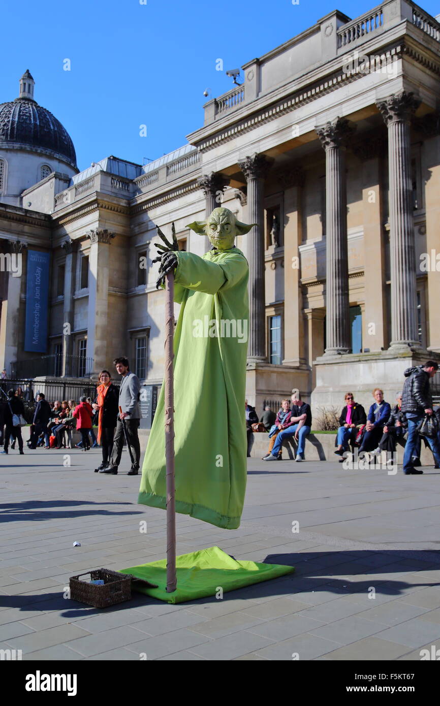 Crowd watching a street performer at Trafalgar Square, London, UK Stock Photo