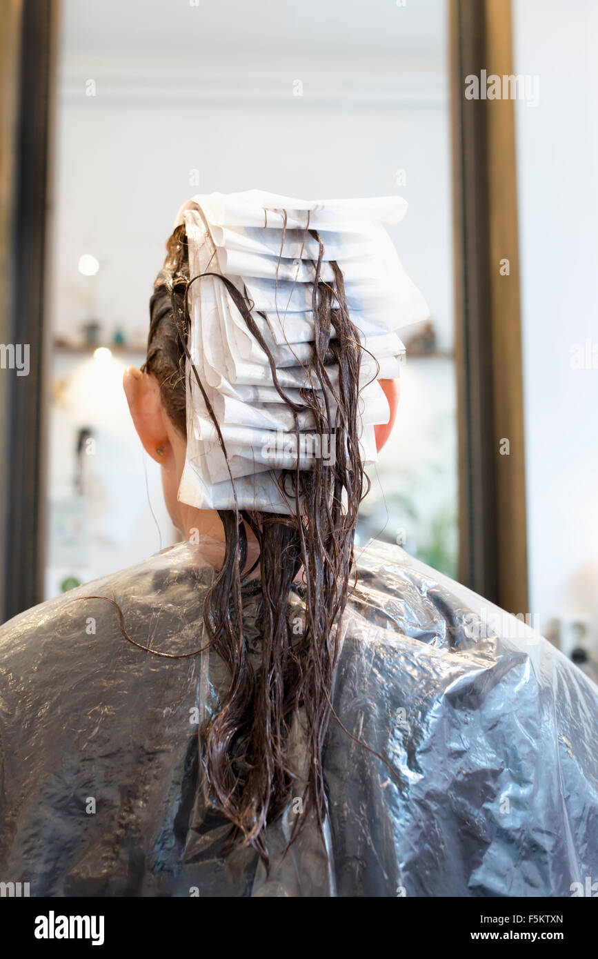 Sweden, Rear view of woman at hair salon Stock Photo