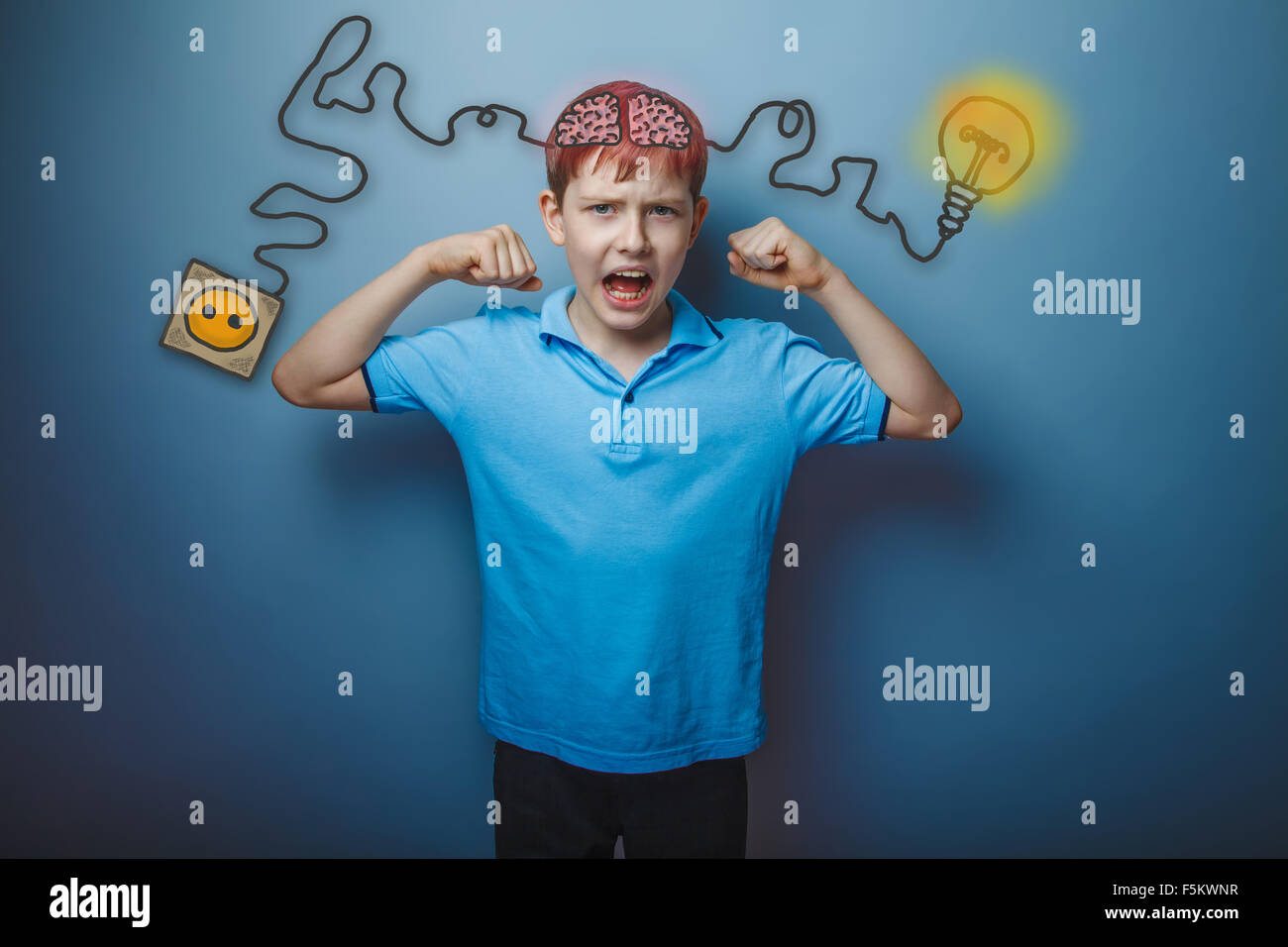 Teen boy shows the strength of his hands and shouts charging cor Stock