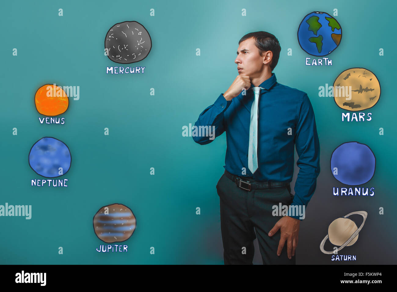 man holds his chin thinking planets of the solar system astronom Stock Photo