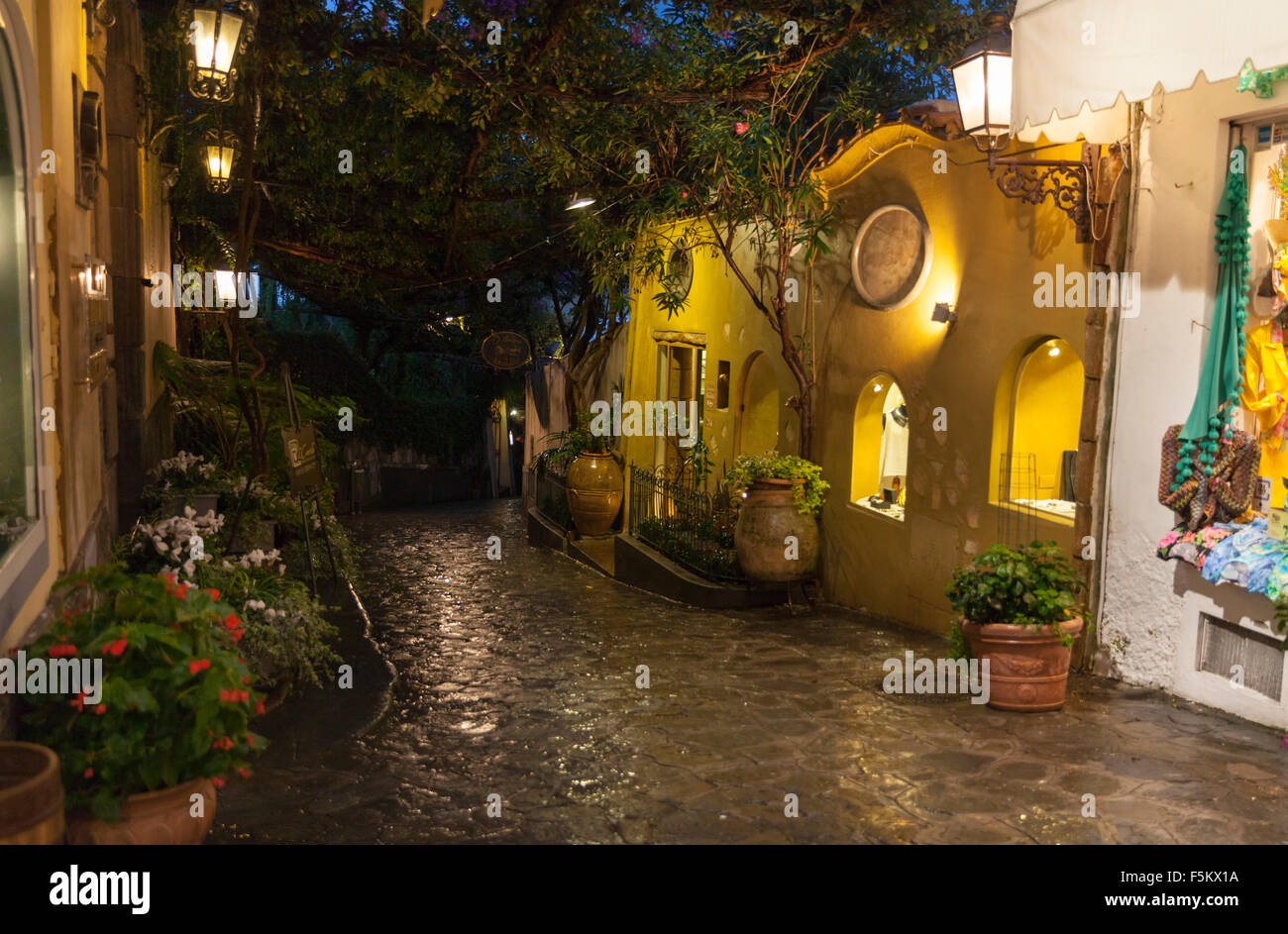 Night shot of the cobblestoned Via dei Mulini, one of the main shopping and restaurant streets in Positano, Amalfi Coast, Italy Stock Photo