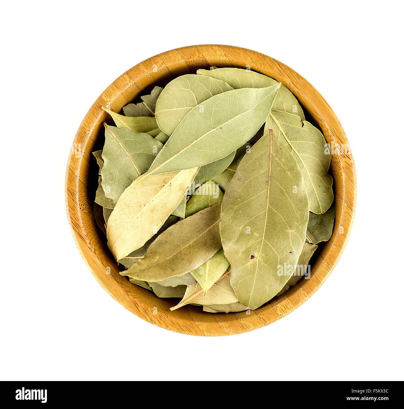 Fragrant bay leaves in a round bowl. Stock Photo