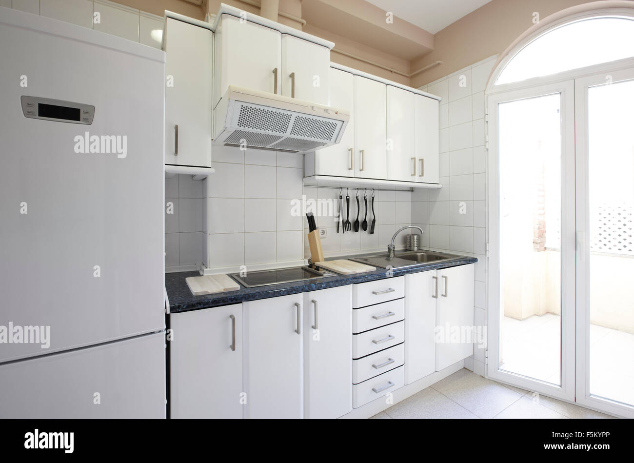 View Of A Domestic Modern Kitchen With Cabinets Drawers And