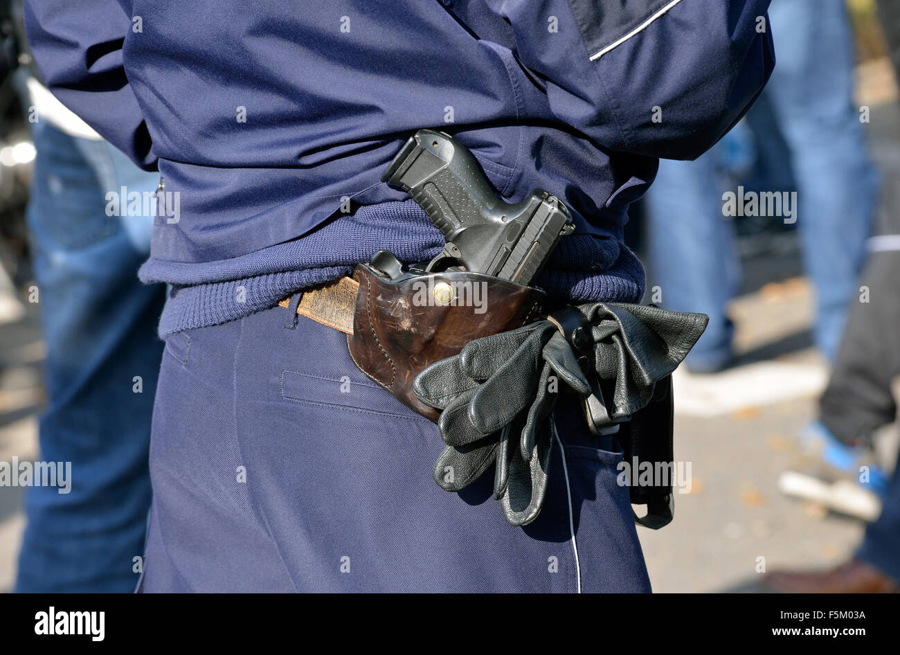 Pistol of a policeman at his holster Stock Photo