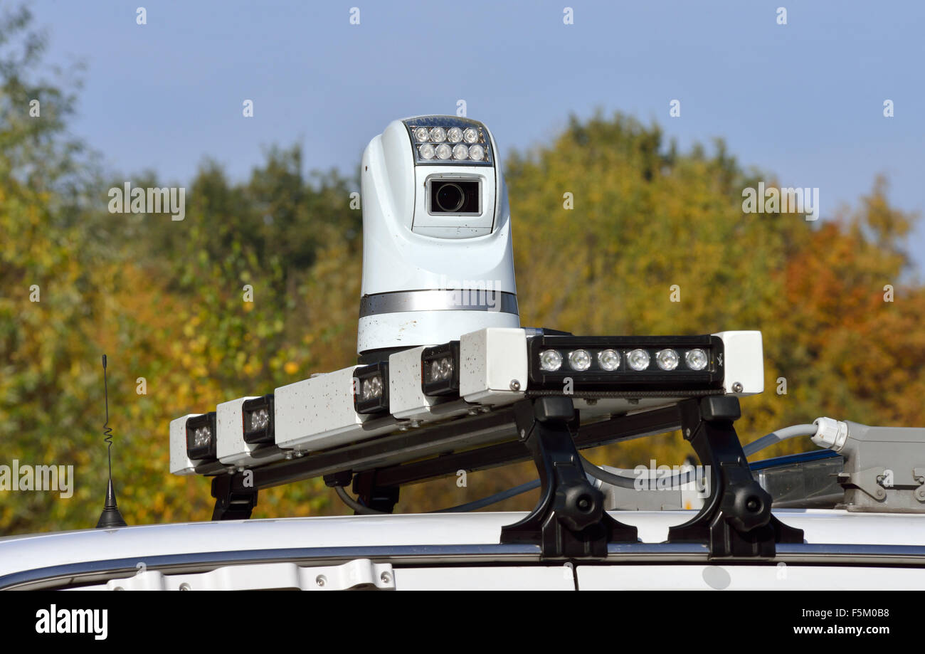 A video camera on the roof of a police car is watching and filming