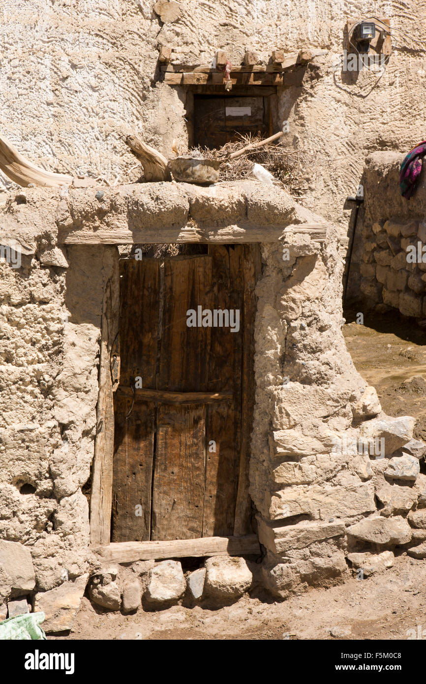 India, Himachal Pradesh, Spiti Valley, Kibber, small wooden door to traditionally built stone house Stock Photo