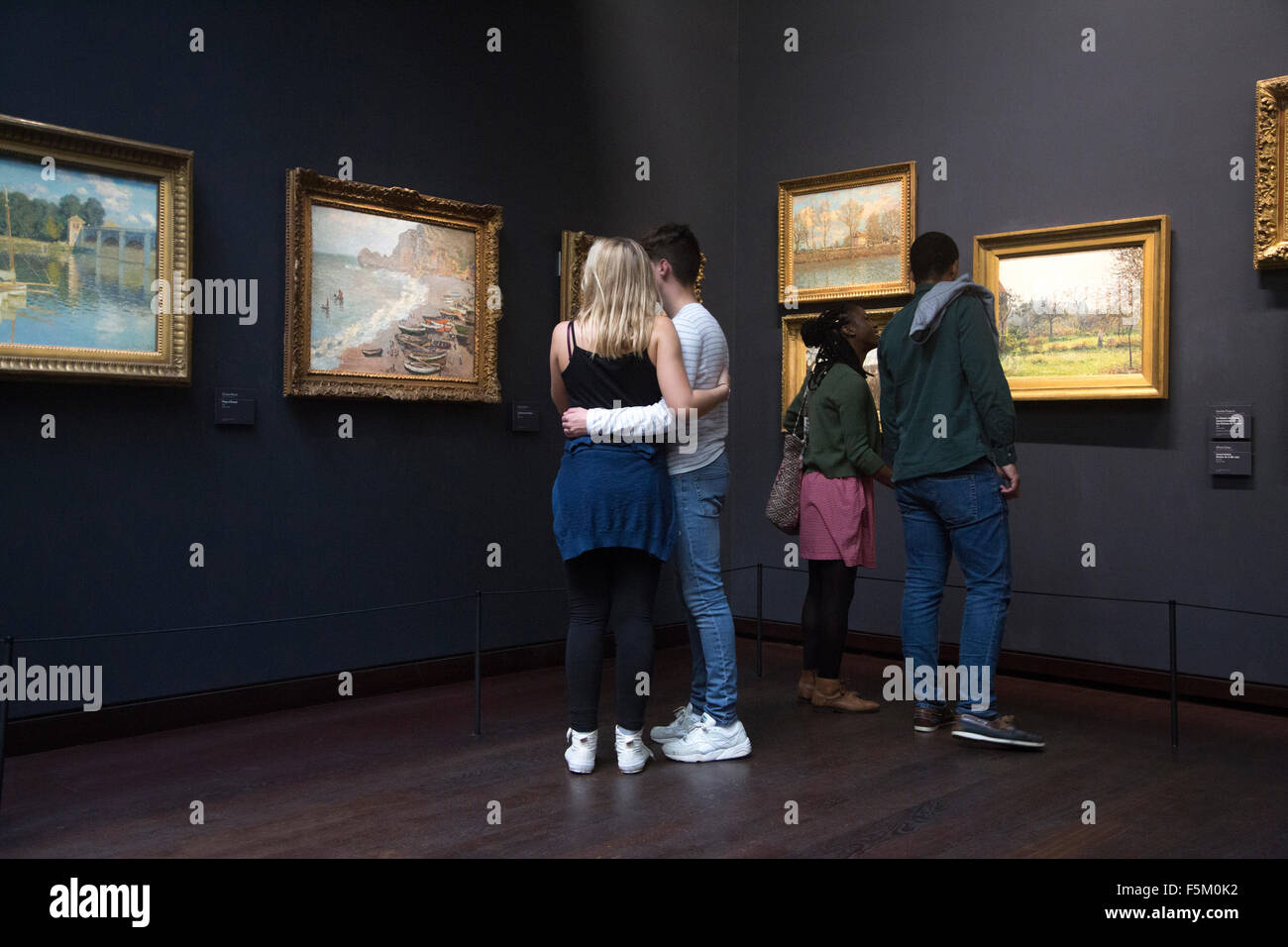 looking at paintings in the musee d'orsay Stock Photo