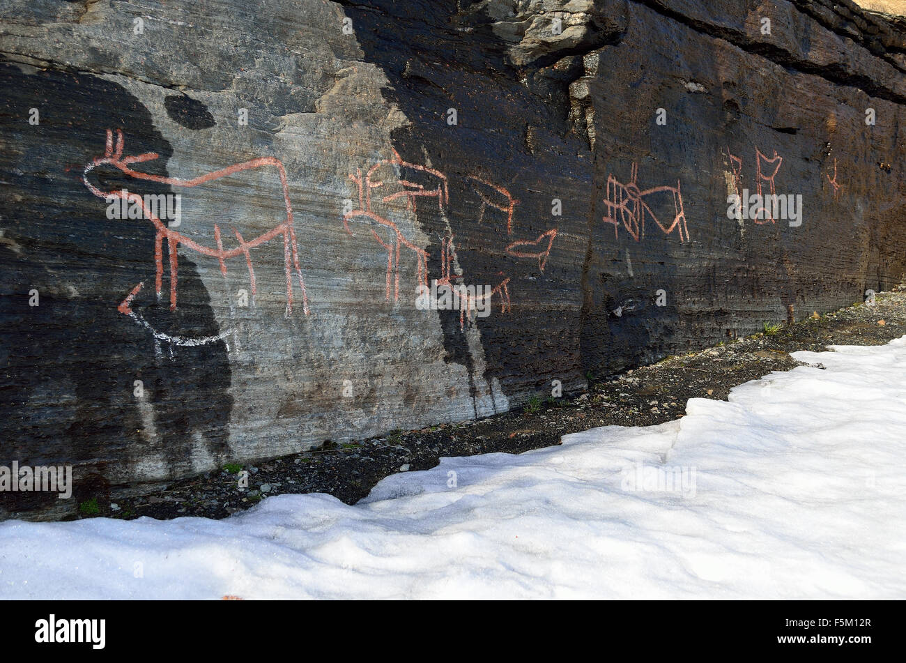 old rock carvings petroglyphs ranging from 2000 to 4500 BC in northern norway Stock Photo