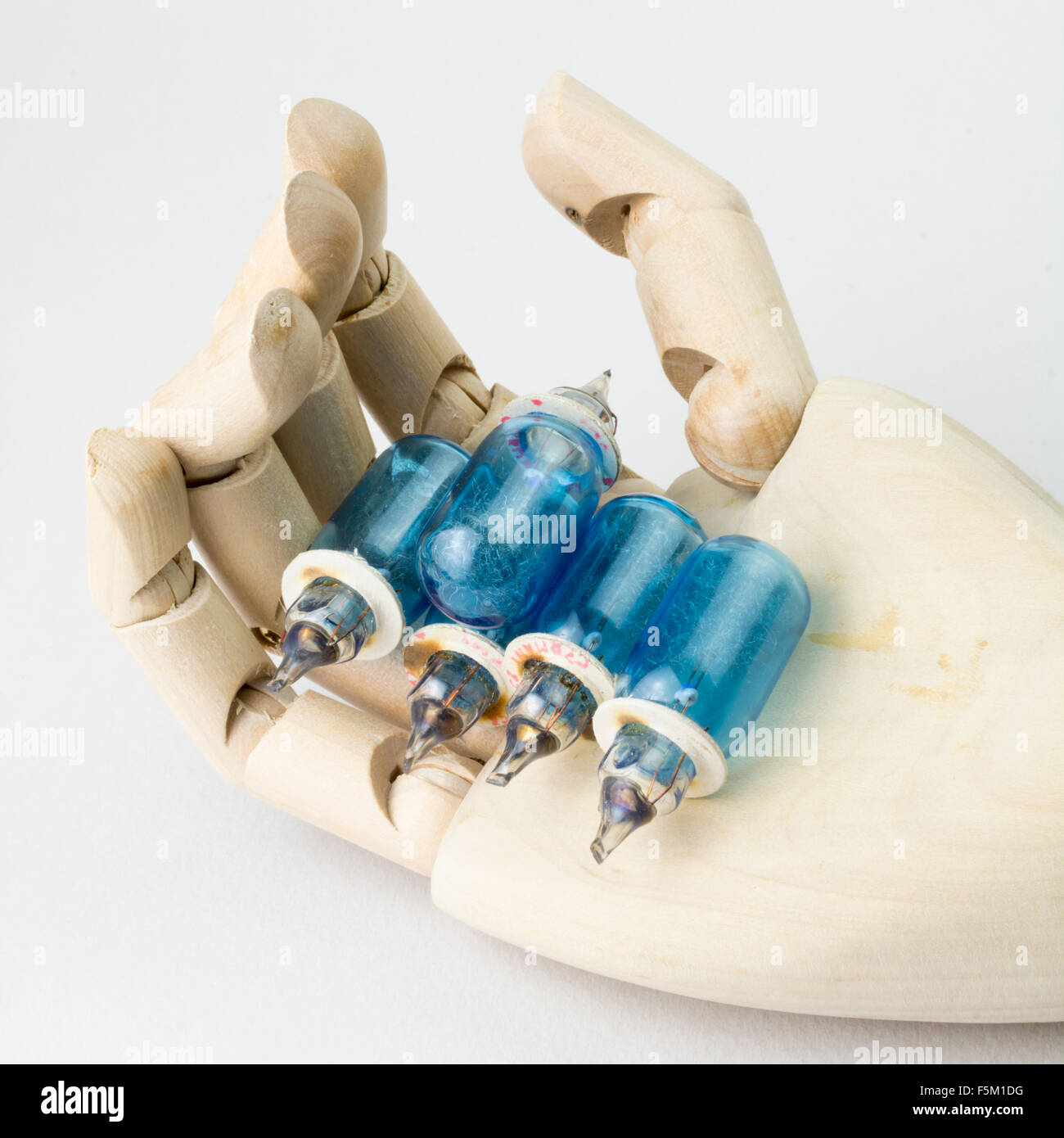 Old Vintage Wotan Flash bulbs in a wooden Mannequin hand Stock Photo