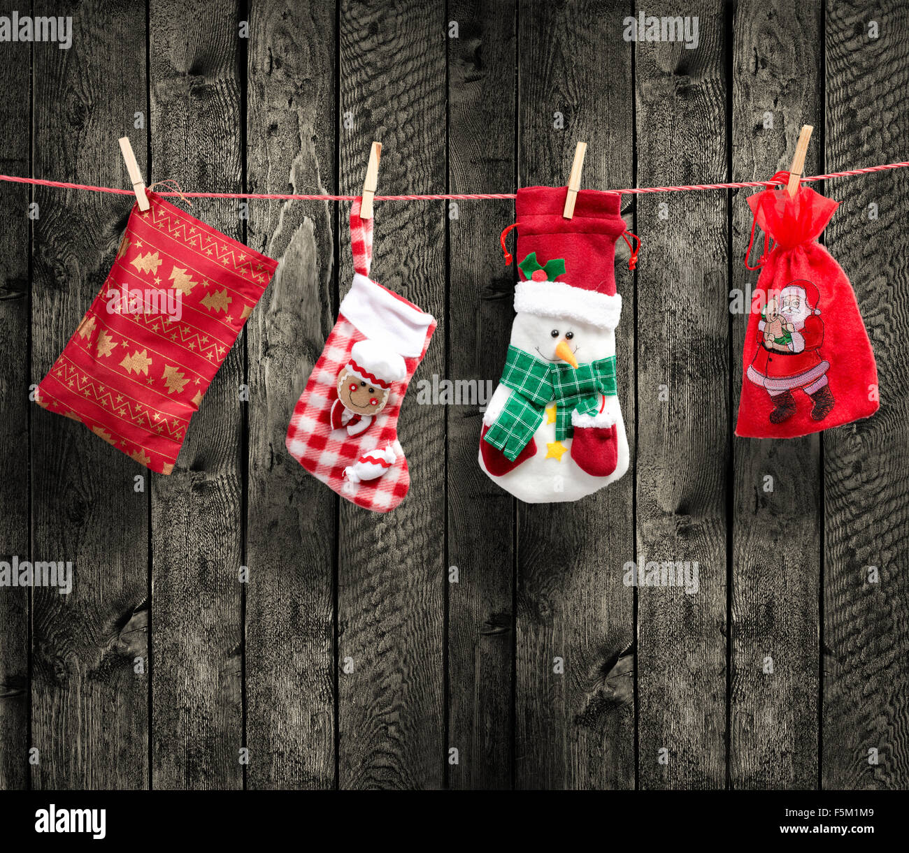 Santa's bag on the clothesline, with wood background Stock Photo