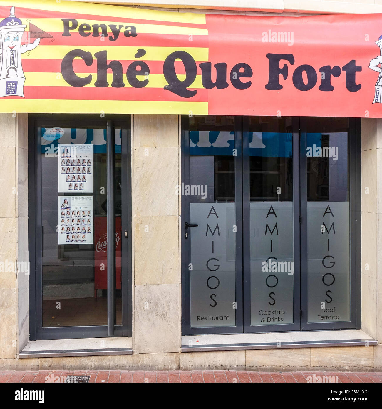 Benidorm, Spain. 6th November, 2015. The streets and premises in the Old Town are being taken over by the Penya groups in preparation for the 275th Fiesta Mayor. The alleyways and narrow streets are festooned with decorations and business premises have been converted into bars and meeting places. Renowned British owned restaurant, Amigos is taken over by the Che Que Fort Penya, owner Perry Mayer says 'No point in opening as every restaurant on that street is a Penya and customers wouldn't get through... besides... we need a break '. Credit:  Mick Flynn/Alamy Live News Stock Photo