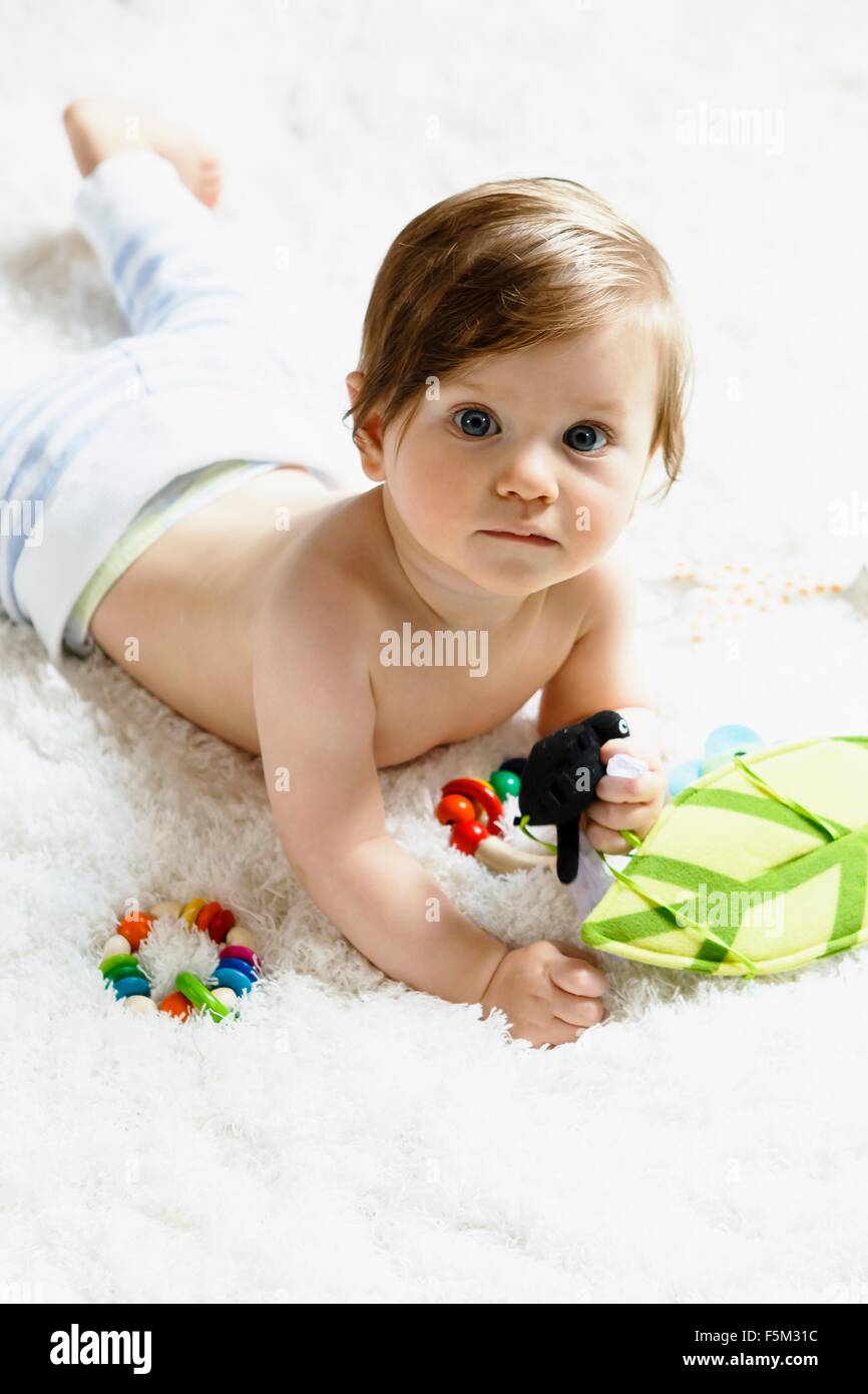 Portrait of a baby boy, lying on front Stock Photo