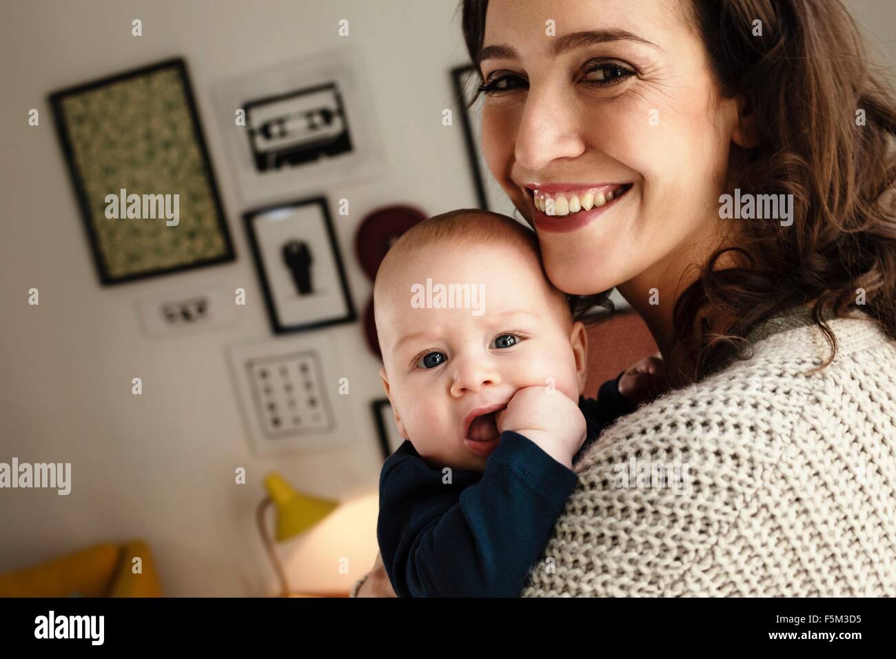 Happy mother holding baby son Stock Photo