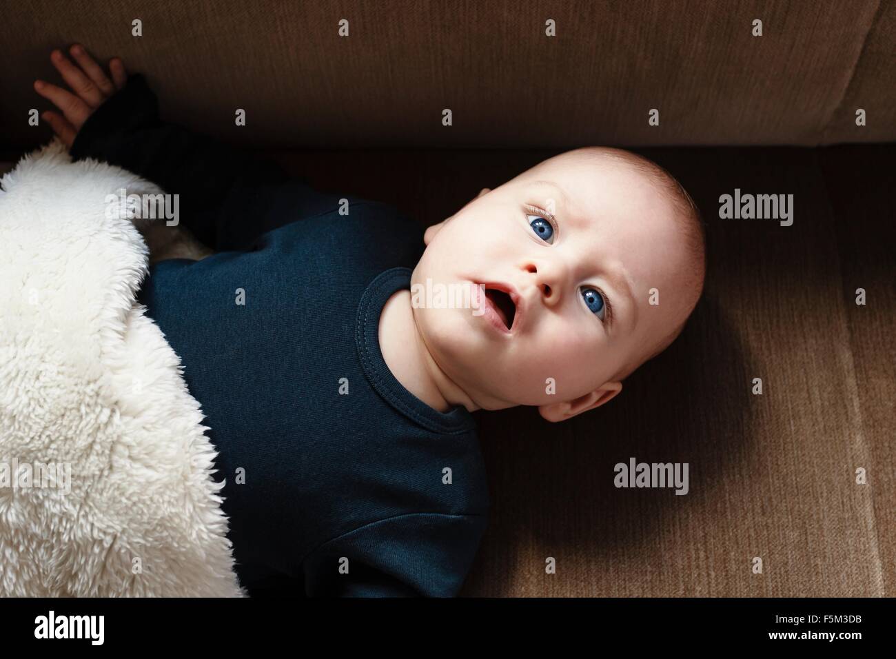 Overhead view of baby boy, looking up Stock Photo