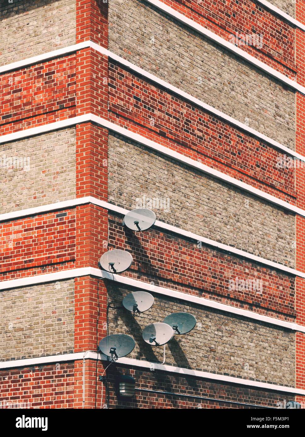 Detail of satellite dishes attached to building Stock Photo