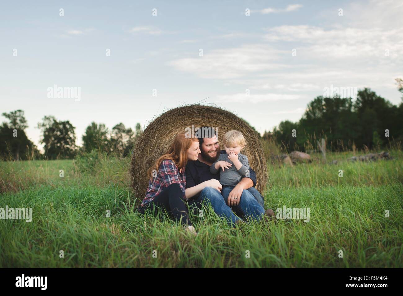 Portrait of young family in field Stock Photo