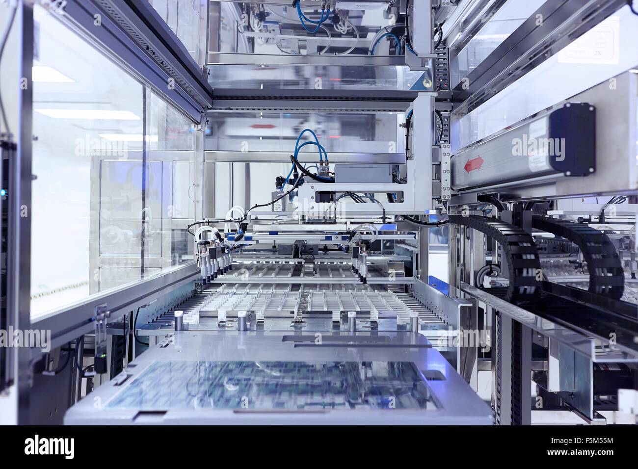 Manufacturing machine in flexible electronics factory clean room Stock Photo