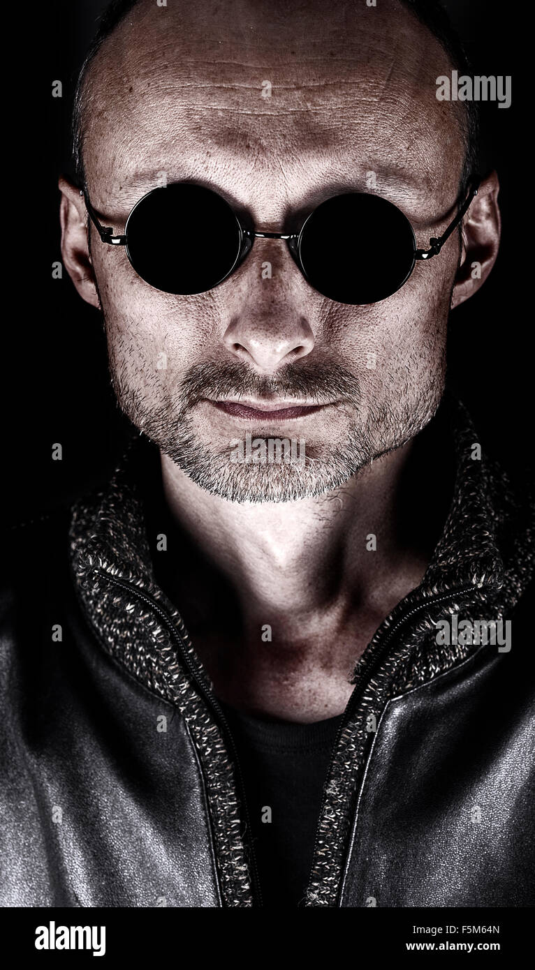 Stylized portrait of a middle-aged man in dark glasses Stock Photo