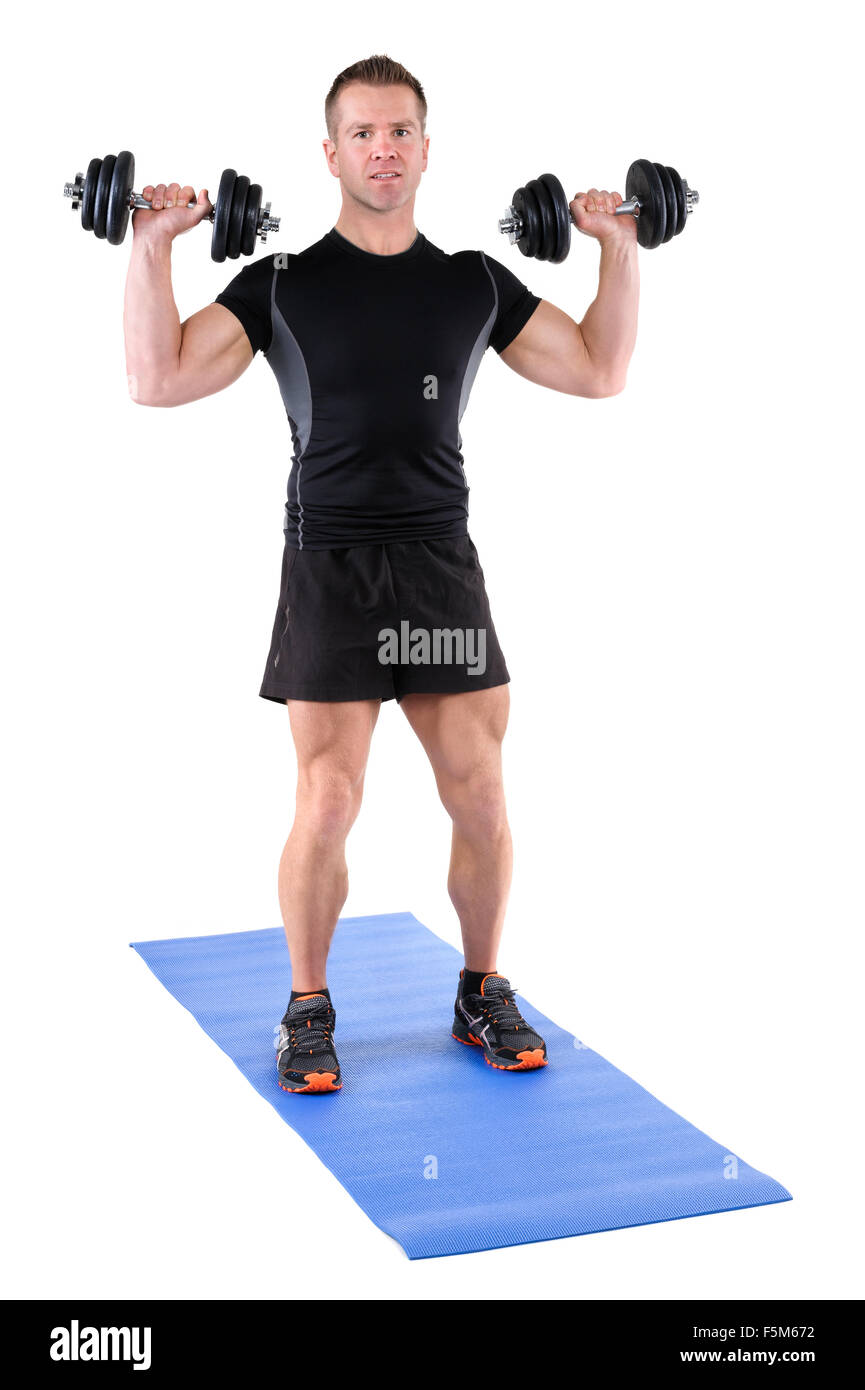 young man shows starting position of shoulder press Stock Photo