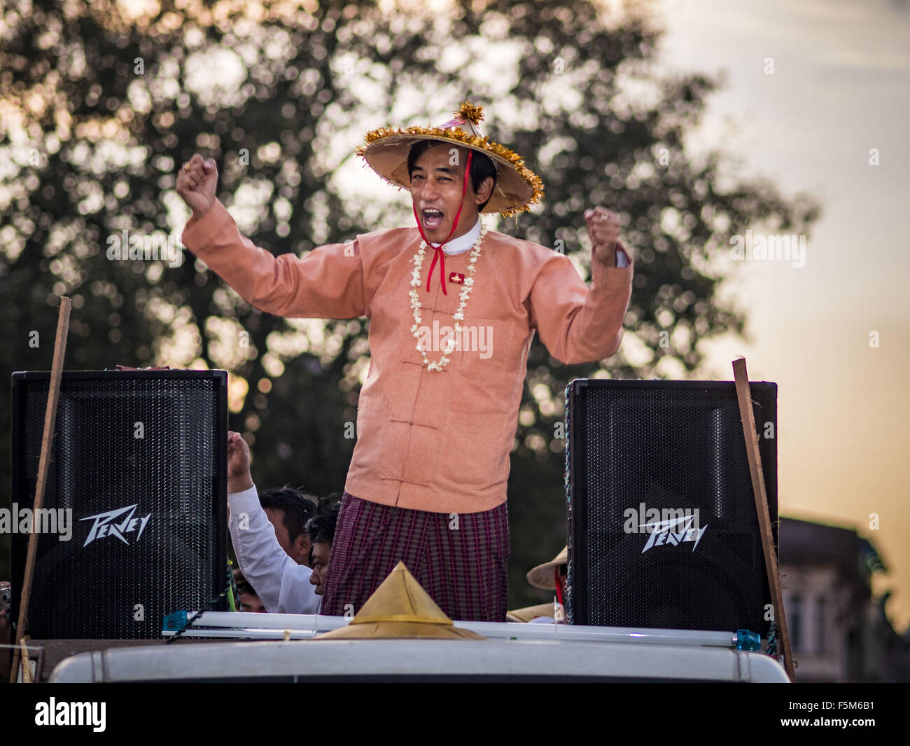 Yangon, Yangon Division, Myanmar. 6th Nov, 2015. KHAING MAUNG YI, a member of the Myanmar parliament for the NFD leads a NFD motorcade away from the final NDF election rally of the 2015 election. The rally was held in central Yangon, next to the historic Sule Pagoda and across the street from Yangon city hall. The National Democratic Force (NDF) was formed by former members of the National League for Democracy (NLD) who chose to contest the 2010 general election in Myanmar because the NLD boycotted that election. There have been mass defections from the NFD this year because many of the peopl Stock Photo