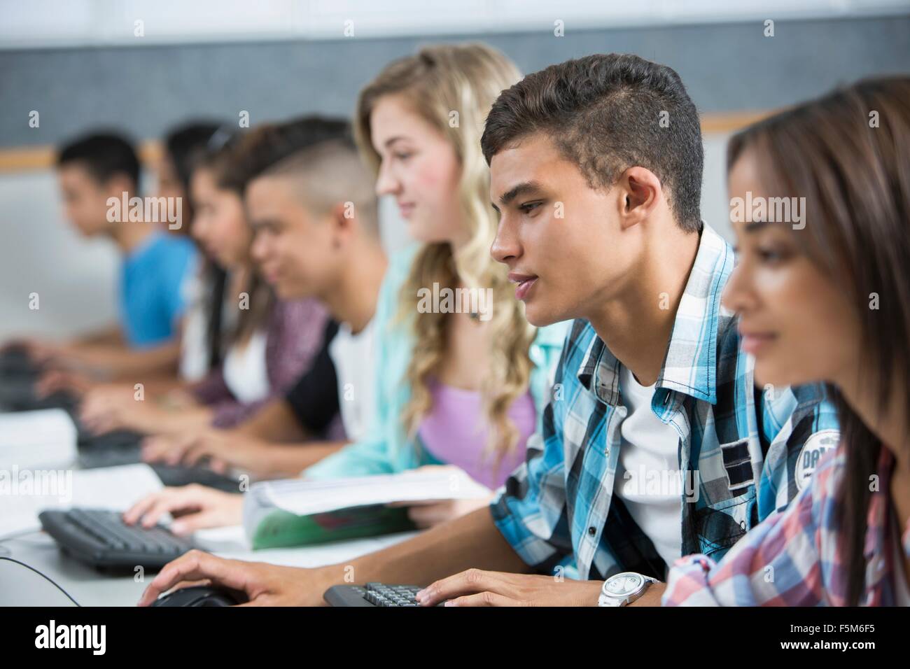 Row of teenage high school students using computers Stock Photo Alamy