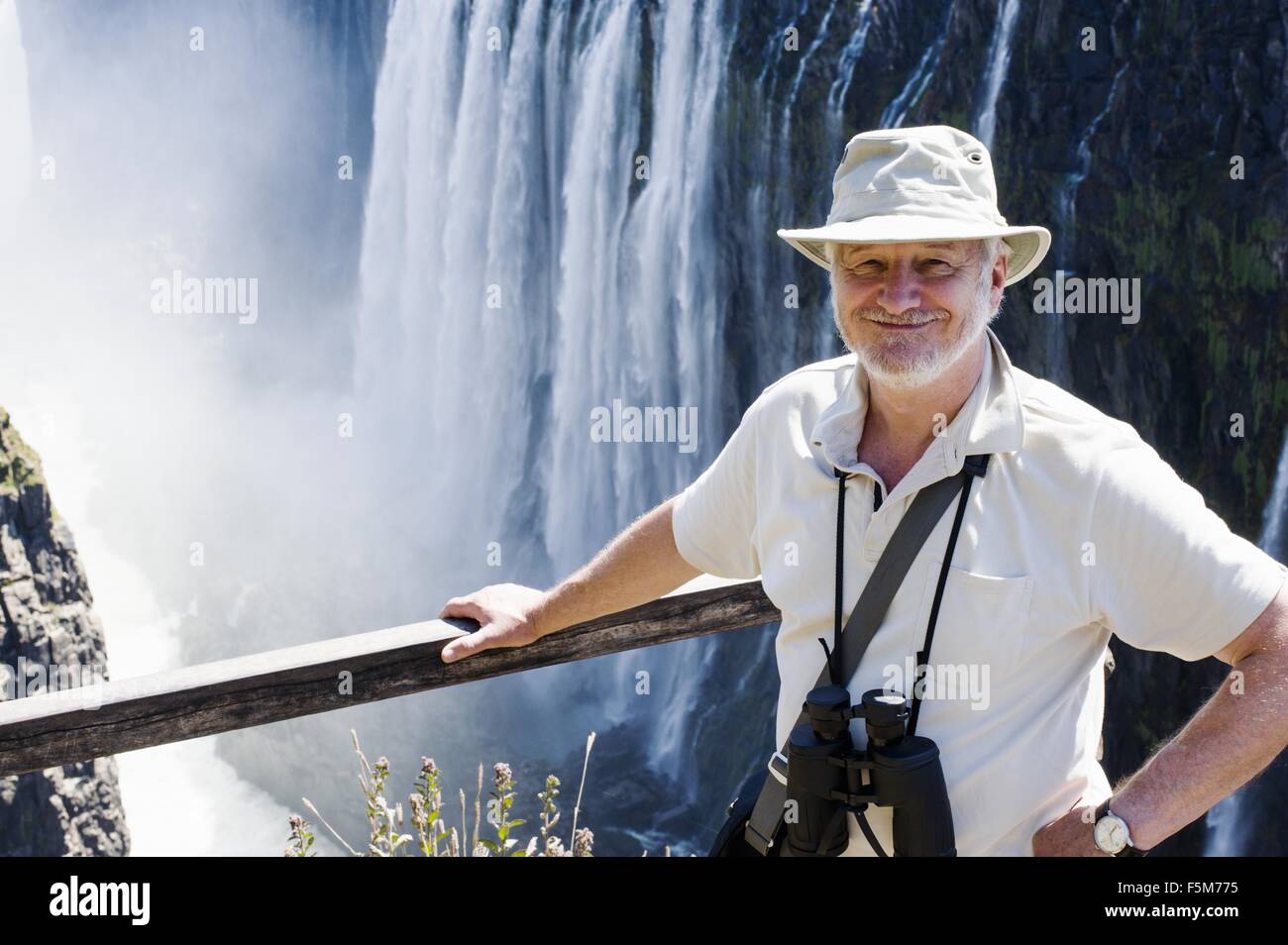Portrait of senior man at Victoria Falls, Zambia Stock Photo