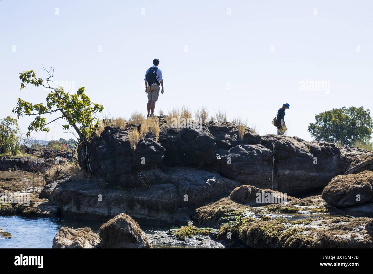 People Exploring Rocks Man exploring river rocks hi-res stock photography and images - Alamy