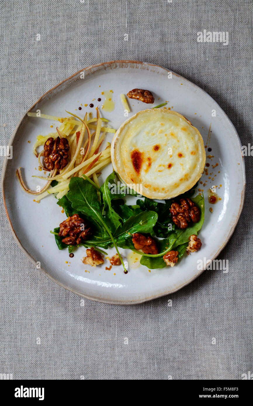 Grilled goat cheese, walnut, apple and rocket salad Stock Photo Alamy