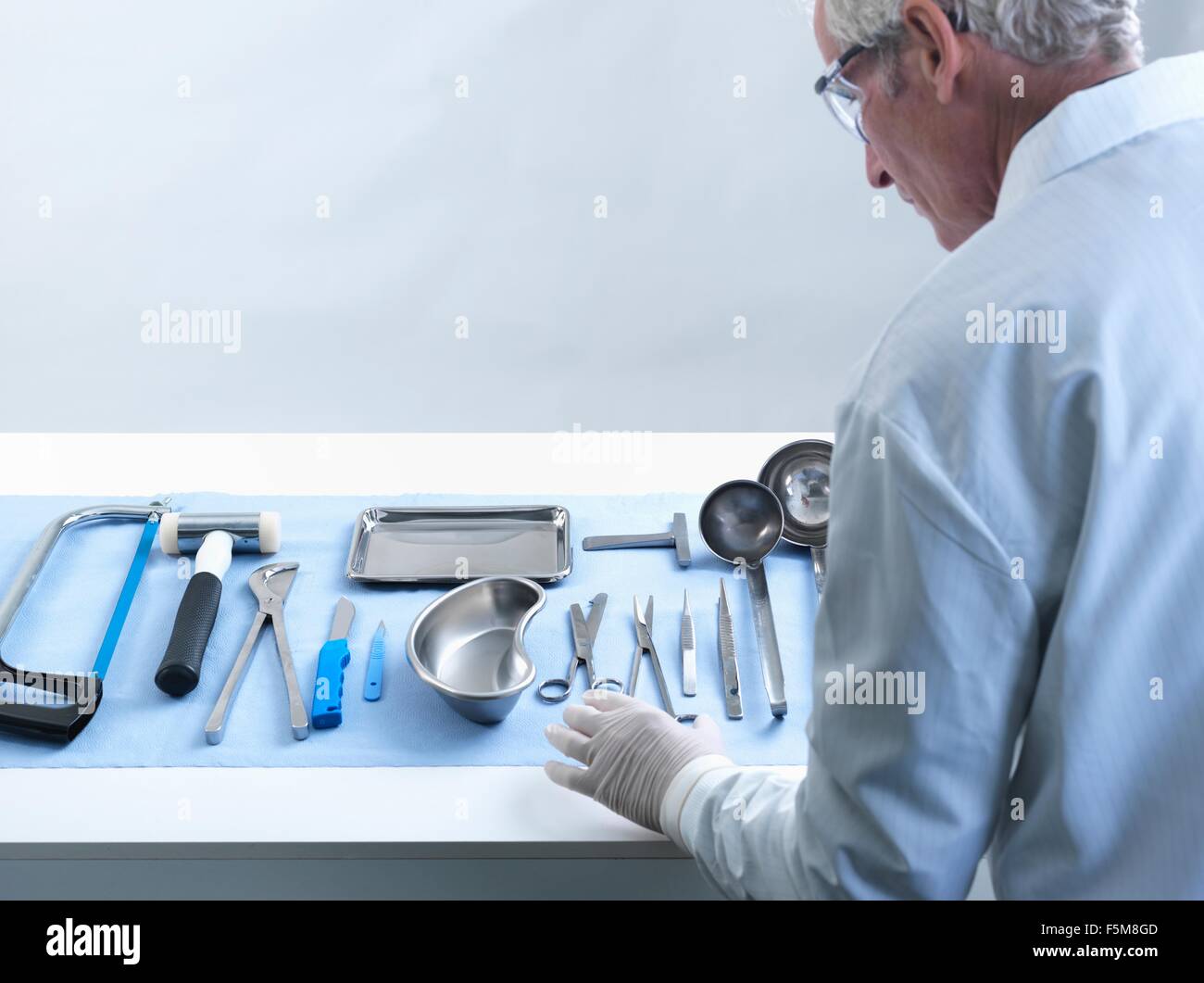 Pathologist preparing for autopsy Stock Photo