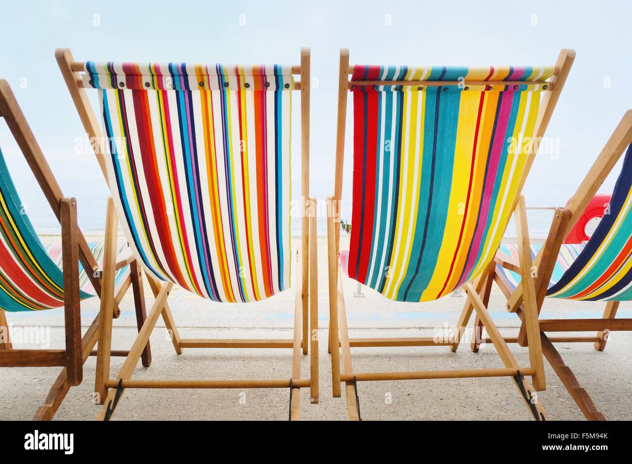 Empty deckchairs in a row Stock Photo