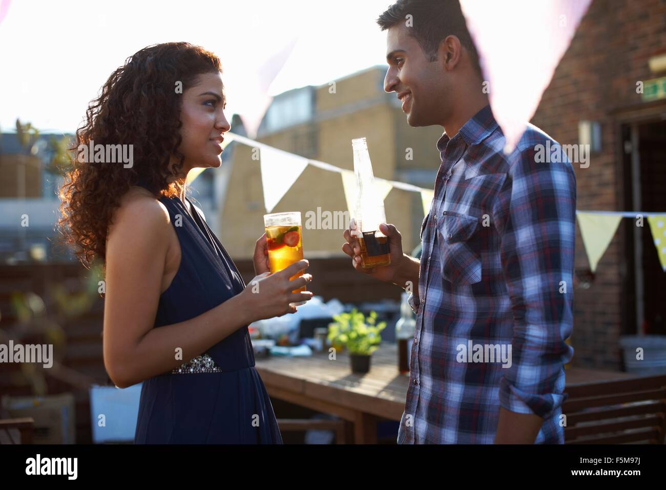 Couple at early evening party Stock Photo